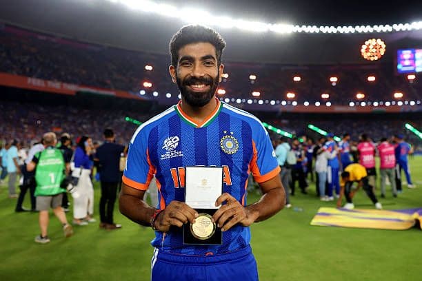 An emotional moment as Bumrah celebrates a historic milestone.